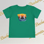 Green t-shirt with a colorful smiley face design on a light gray background