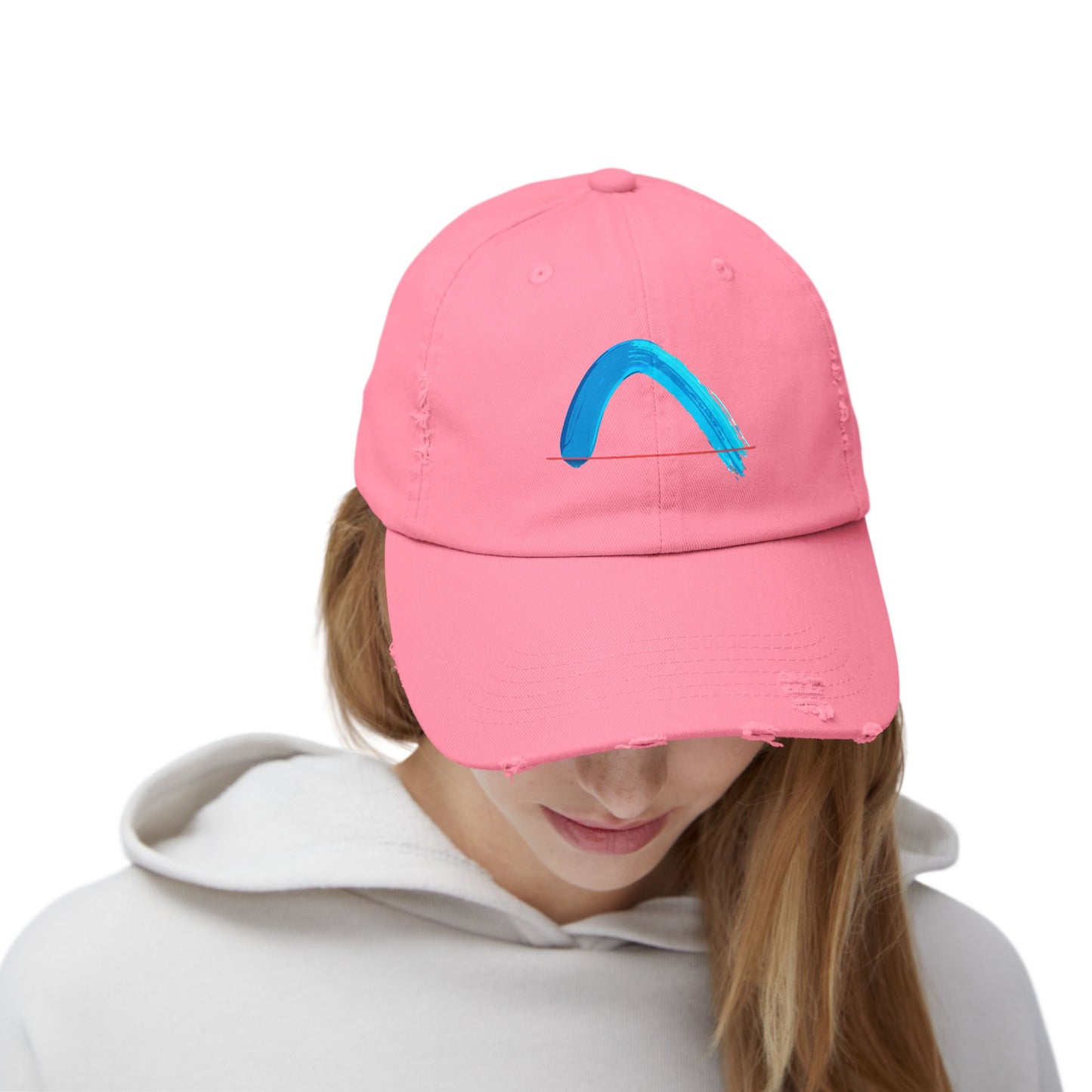 Person wearing a pink cap with a blue arch brush-strock on a white background