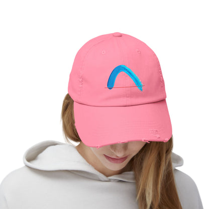 Person wearing a pink cap with a blue arch brush-strock on a white background