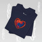 Navy blue t-shirt with a colorful heart-shaped puzzle design in red and blue, between two hands.
