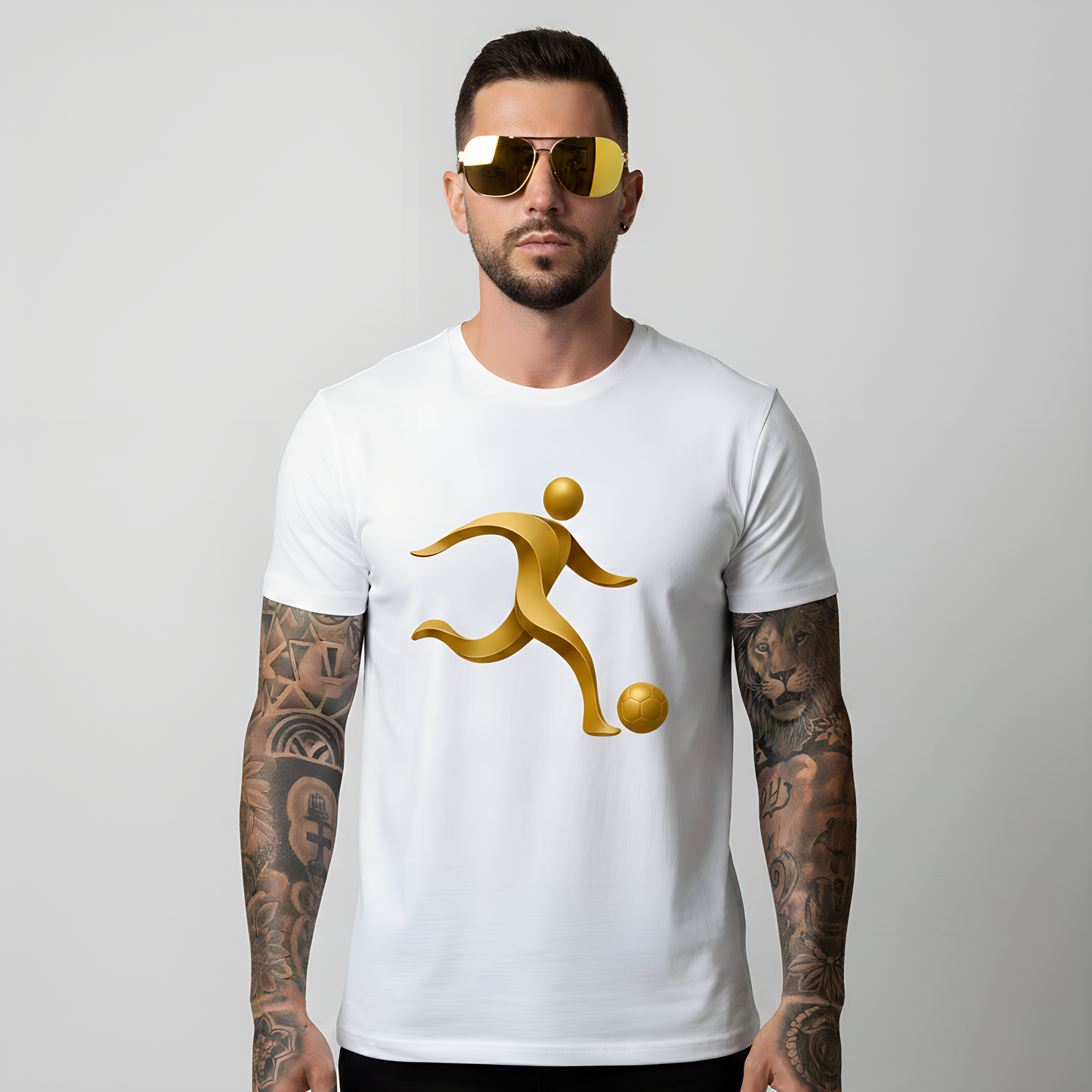 Man wearing a white t-shirt with a golden soccer silhouette graphic design on a plain background.