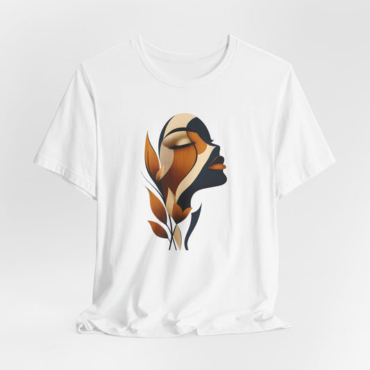 White t-shirt with a stylized face design in brown and black, botanical art inspiration, on a white background