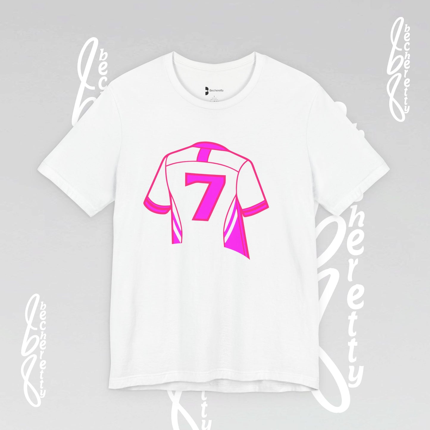 White t-shirt with pink graphic design on a gray background