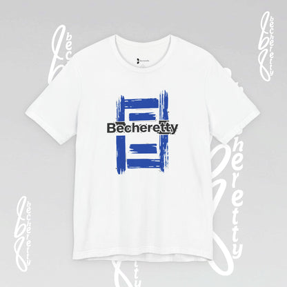 White t-shirt with blue and black graphic design on a gray background