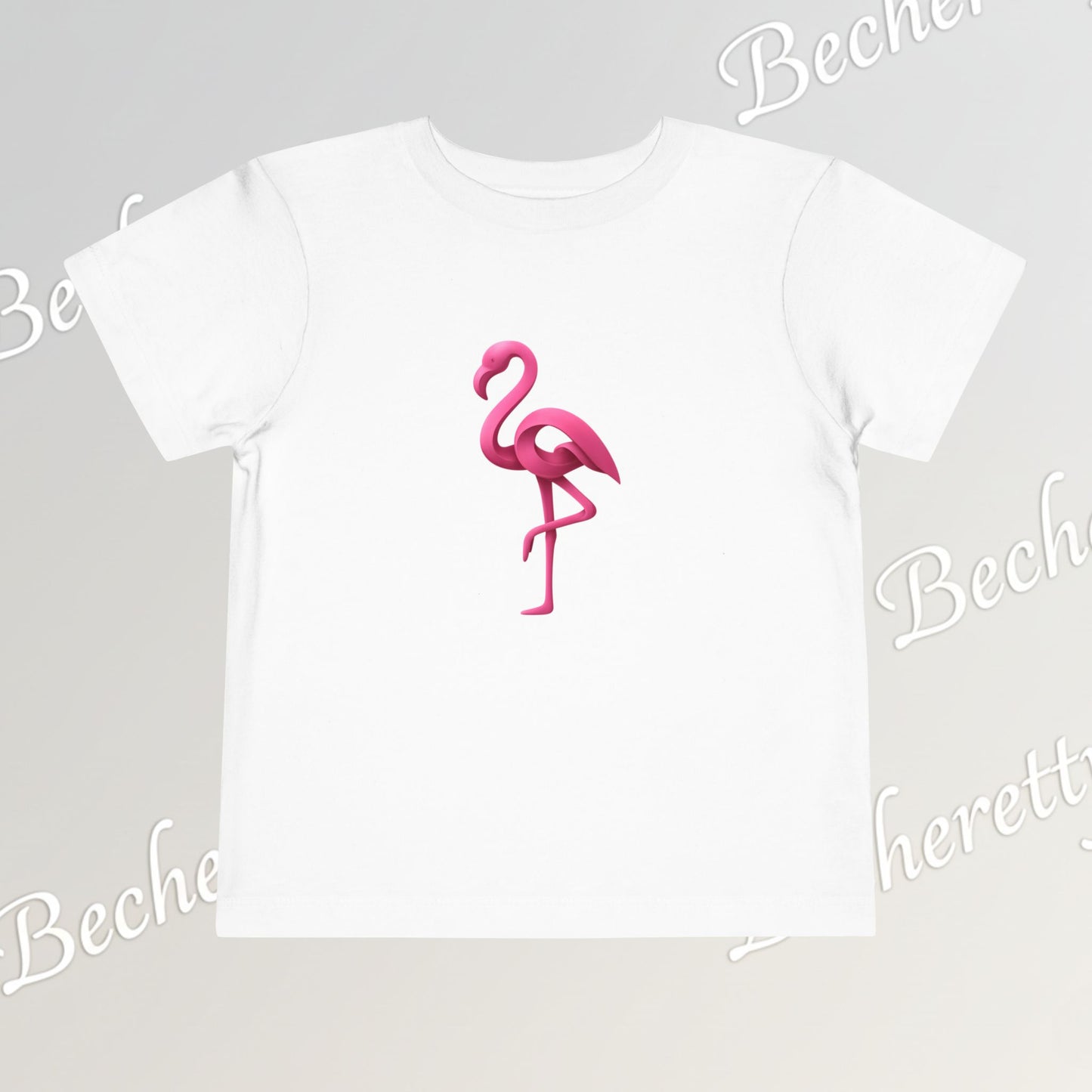 White t-shirt with a pink flamingo design on a light gray background