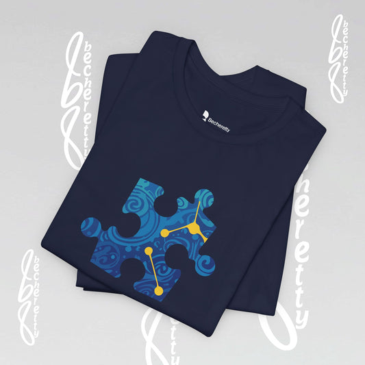 Navy t-shirt with a blue abstract puzzle piece in the middle.