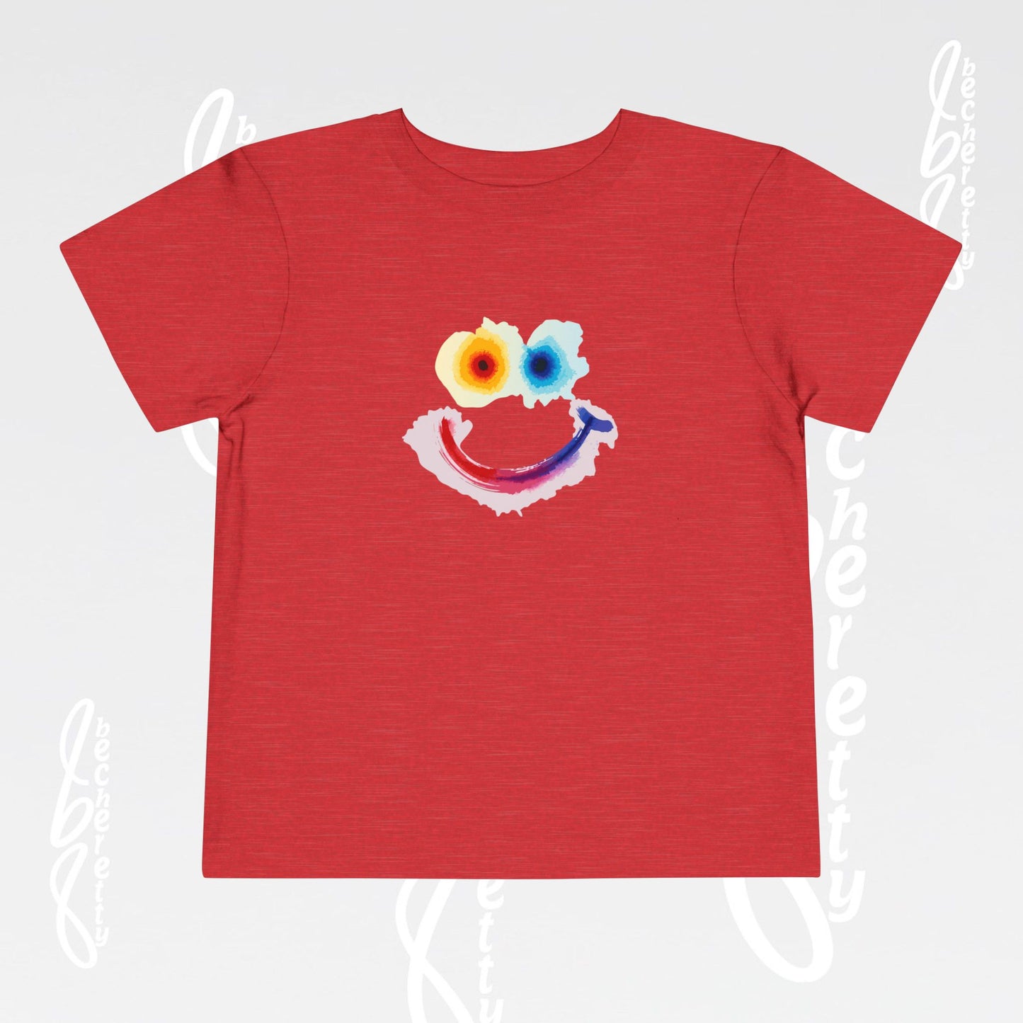 Red t-shirt with a colorful smiley face design on a light gray background