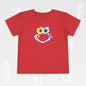 Red t-shirt with a colorful smiley face design on a light gray background