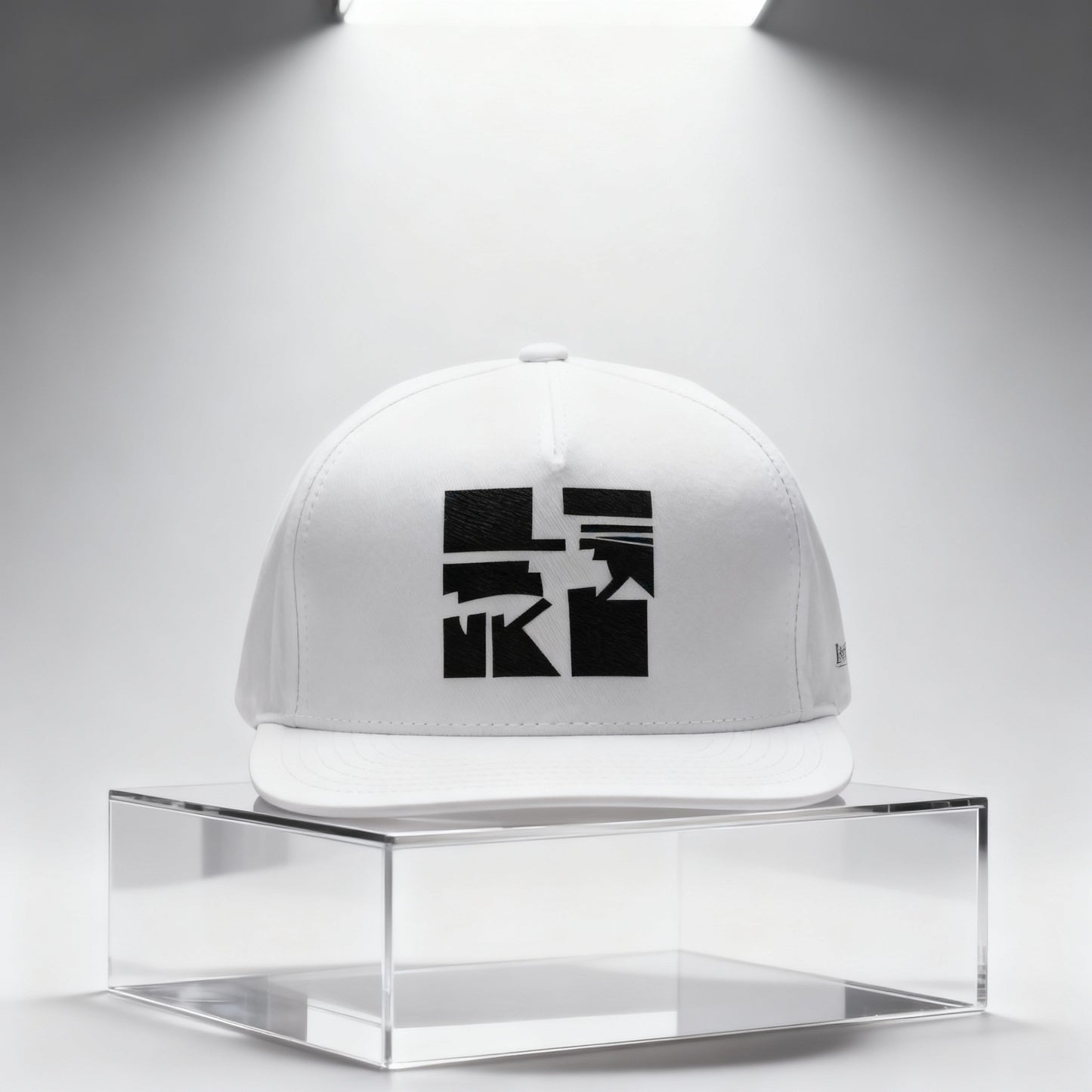 White cap with black art graphic on a clear stand against a white background