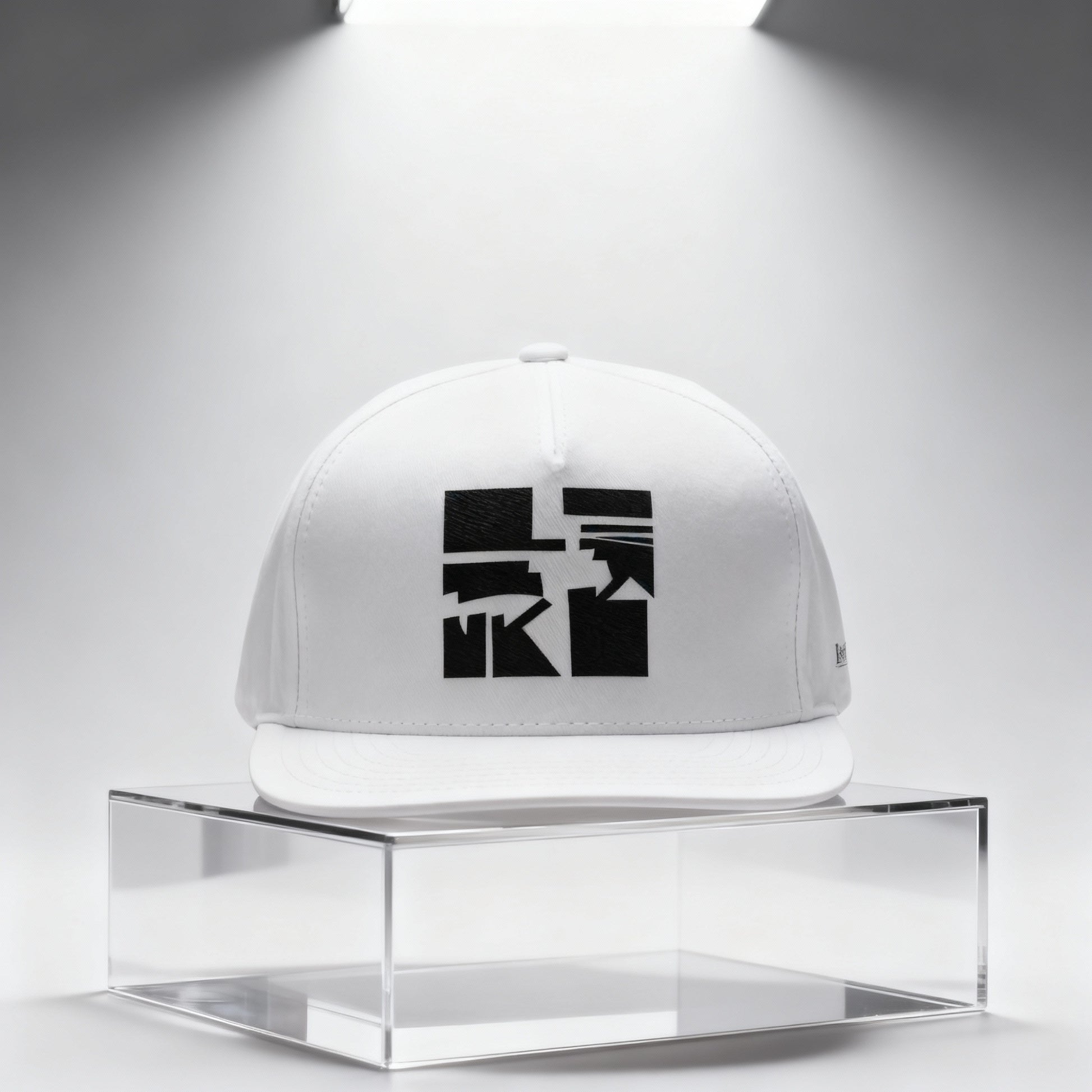 White cap with black art graphic on a clear stand against a white background